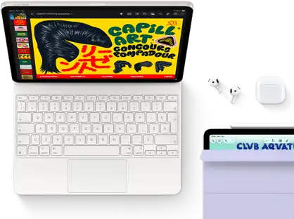 iPad Air, comète, graphismes colorés à l’écran, fixé à un Magic Keyboard, des AirPods Pro et un Apple Pencil Pro