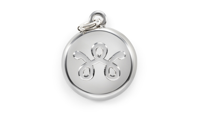 A silver charm that doubles as a personal safety device with a discreet panic button.