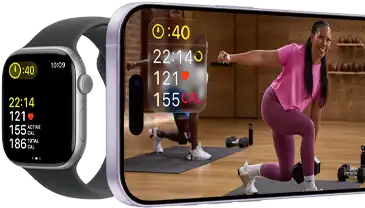 Apple Watch next to iPhone with Apple Fitness+ class on screen