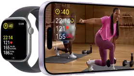 Apple Watch à côté d’un iPhone affichant une séance Apple Fitness+