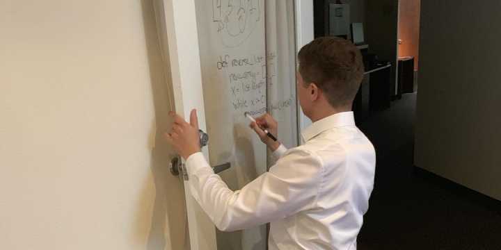 Dylan solving a whiteboard problem