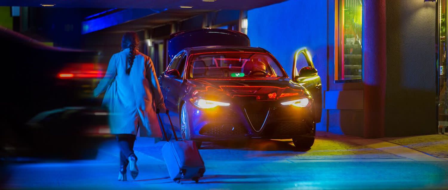 Woman getting into a Lyft at the airport.