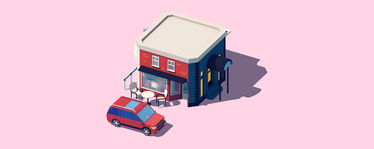 A red van with a pink Lyft amp in front of a cafe.