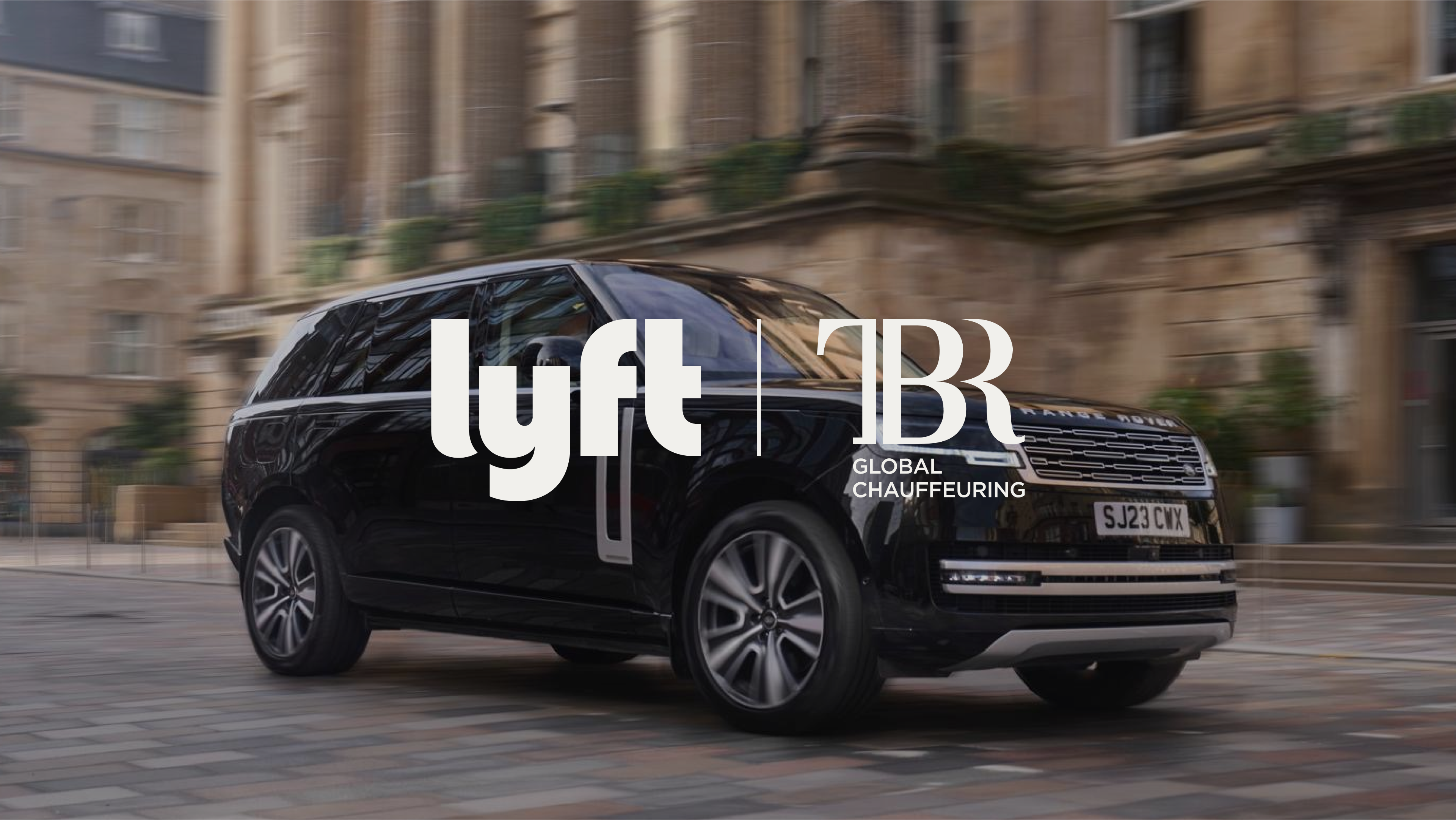 Black luxury SUV driving past historic buildings with Lyft and TBR Global Chauffeuring logos overlaid.