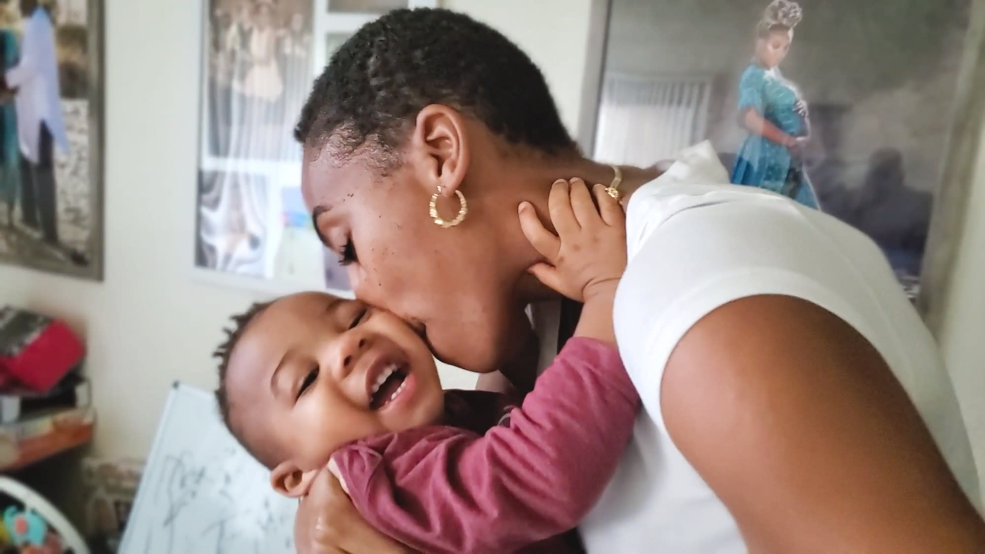 Child tax credit, mom kissing her kid