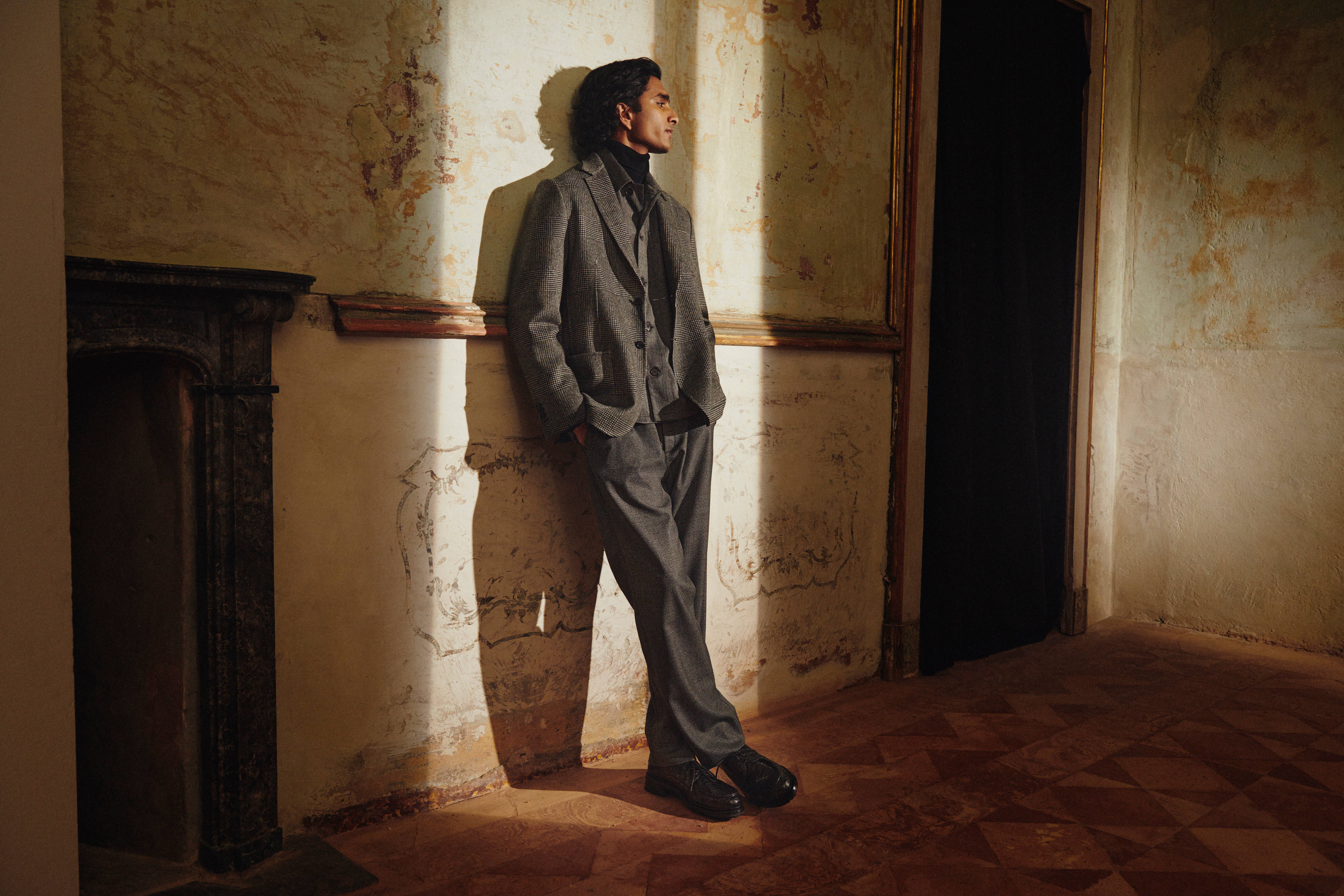 Brioni model wearing a suit from Fall winter 22 collection