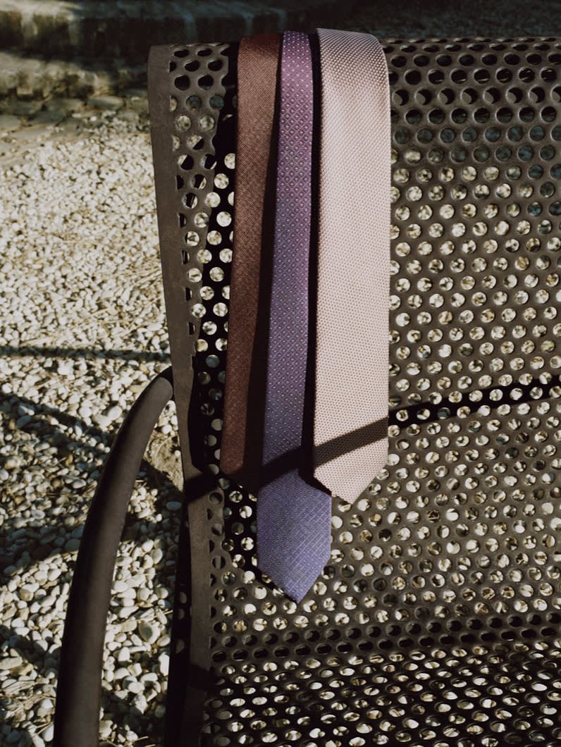 Three Brioni silk ties in different patterns and colours
