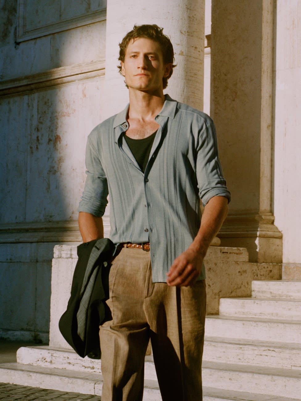 Male model wearing a knitted shirt and linen trousers