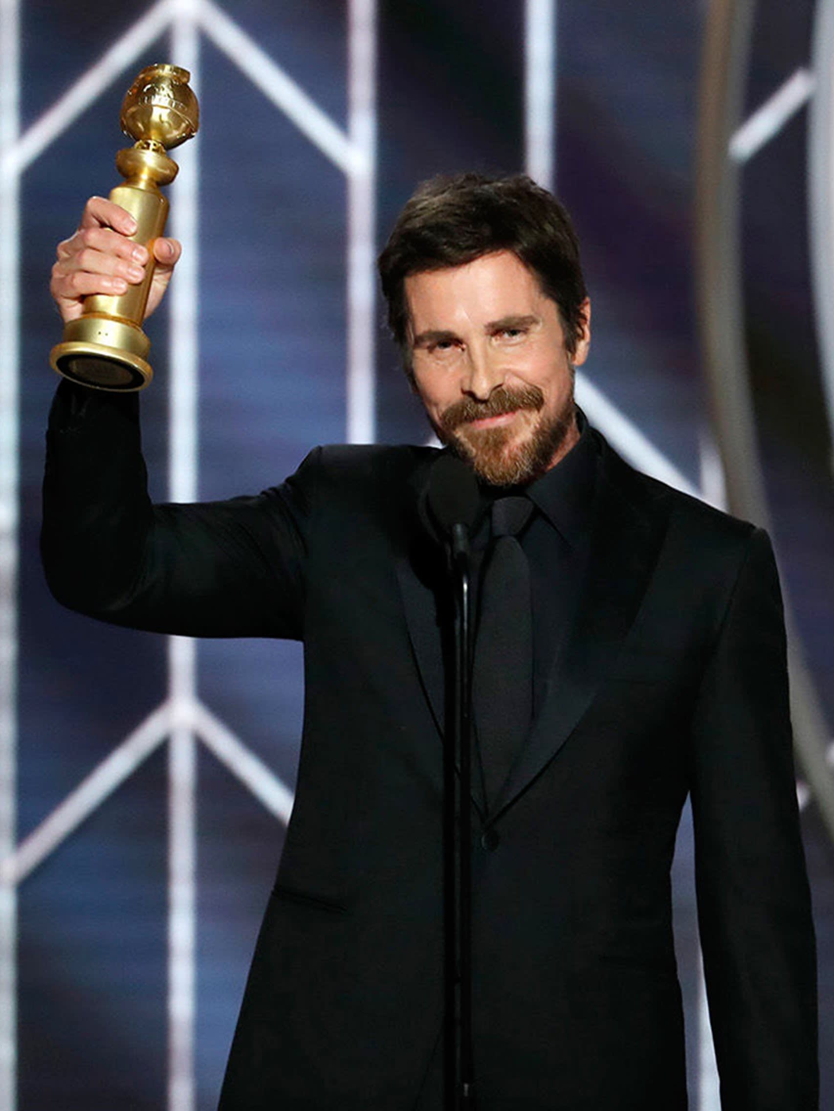 Christian Bale wearing a Brioni bespoke black tuxedo