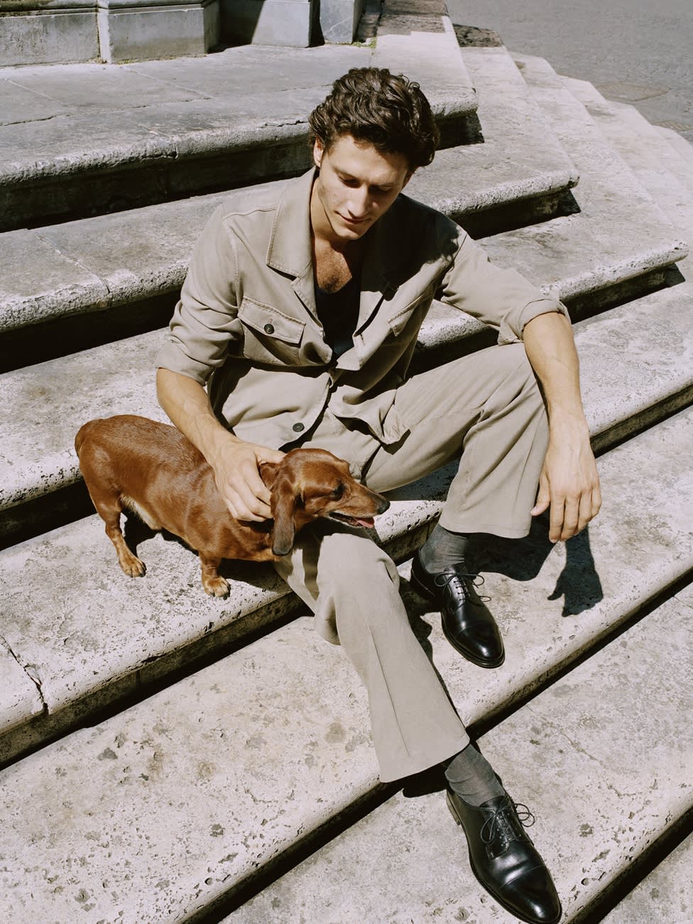 Male model wearing a beige washed silk blouson and trousers