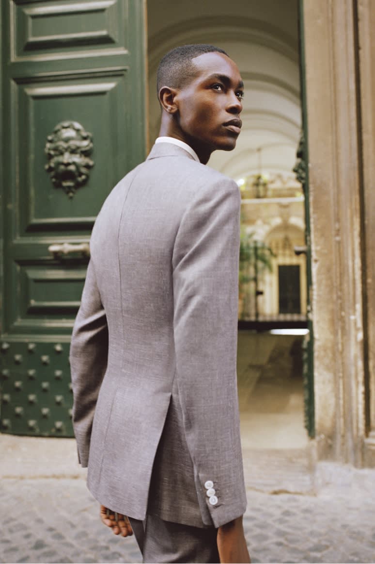 Male model wearing a Brioni purple suit in cashmere, silk and linen