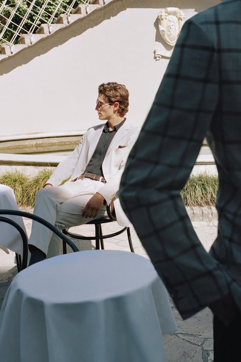 Male model wearing a Brioni beige suit in Sea Island cotton