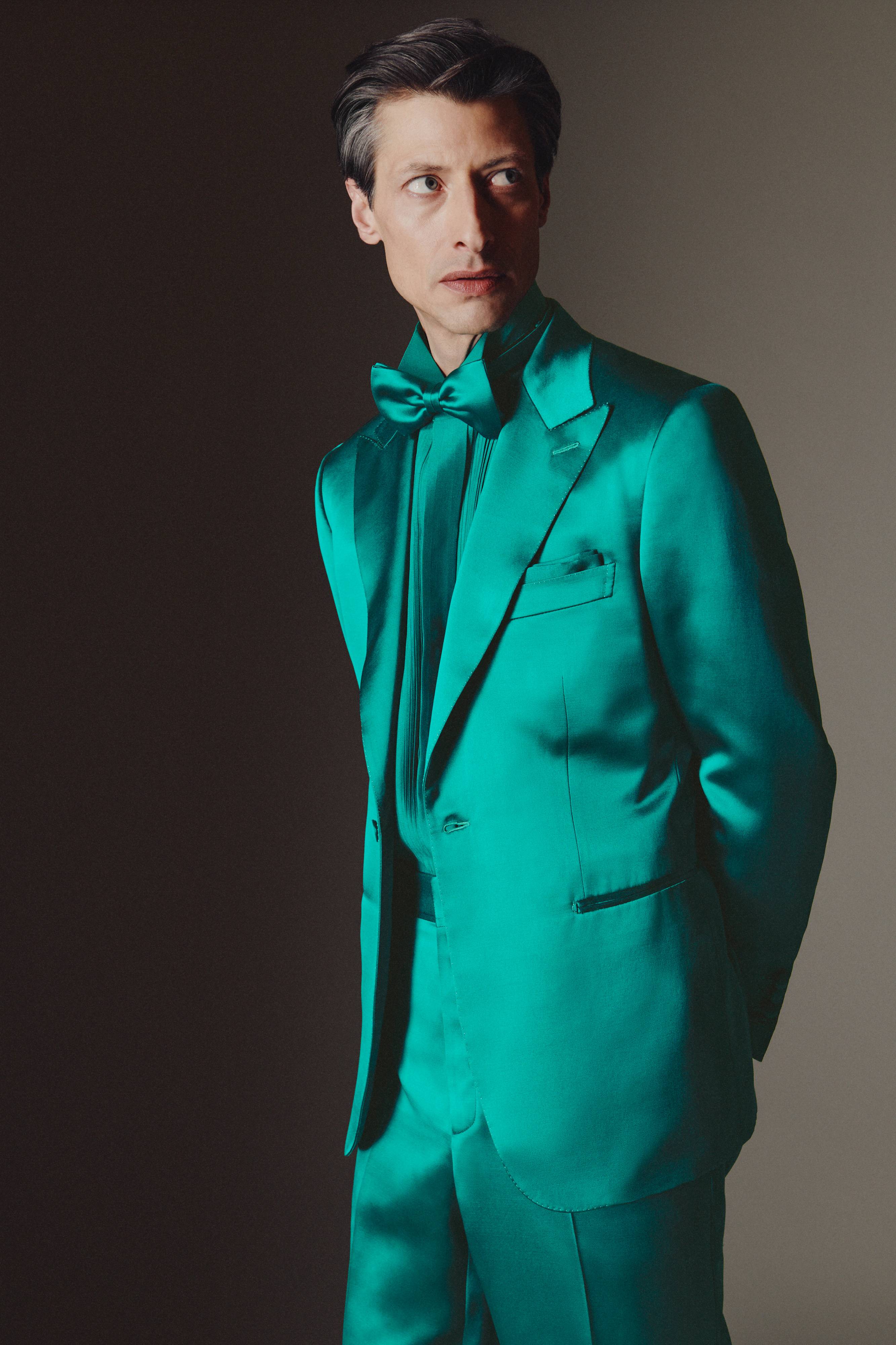 Brioni model wearing green silk tuxedo from fall winter 22
