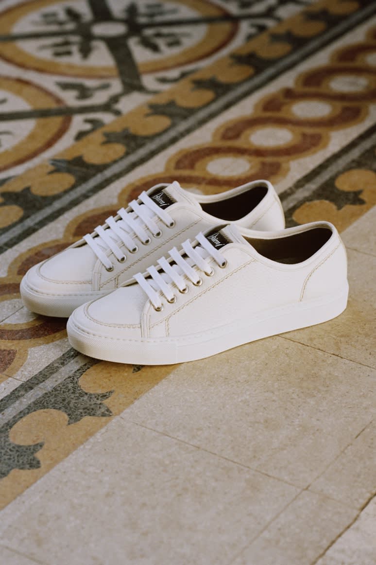 A pair of white Brioni sneakers in deerskin