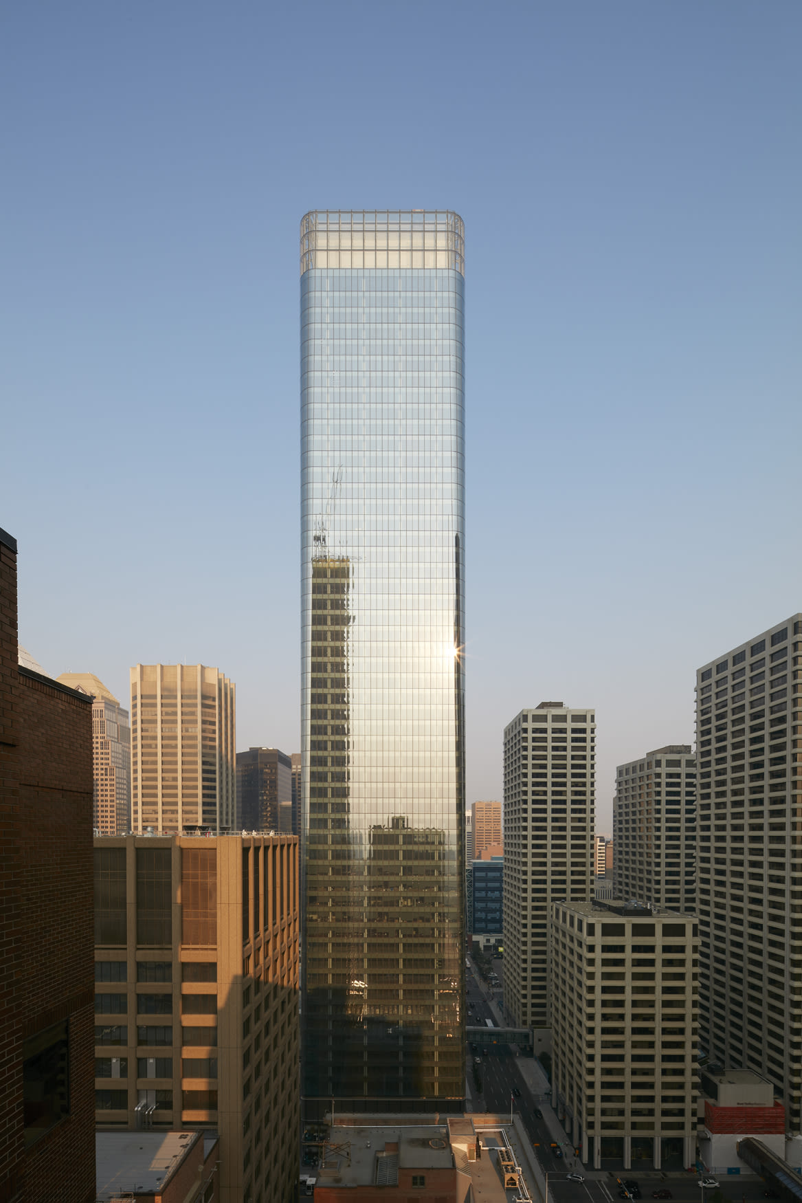 The East Tower's elegant silhouette reflects and refracts the clear sunlight from the Rockies