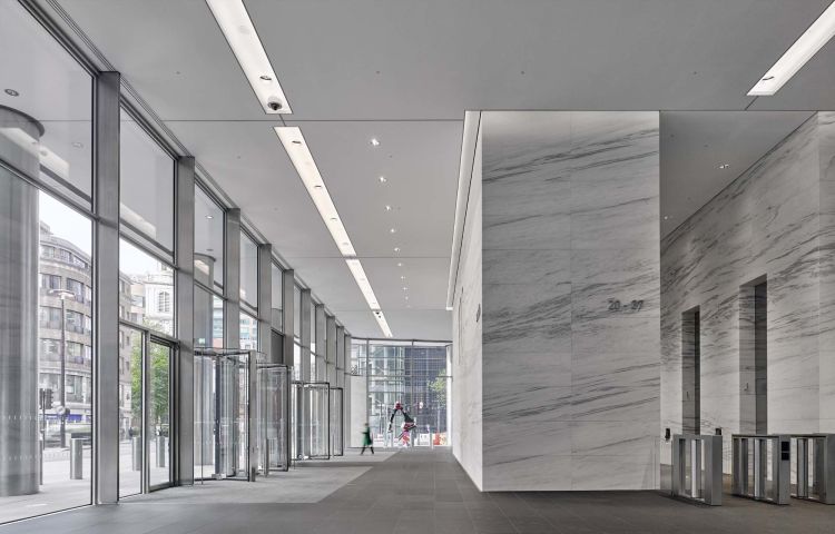 The generous light filled lobby with stone clad cores designed to appear as if hewn from a solid block of marble