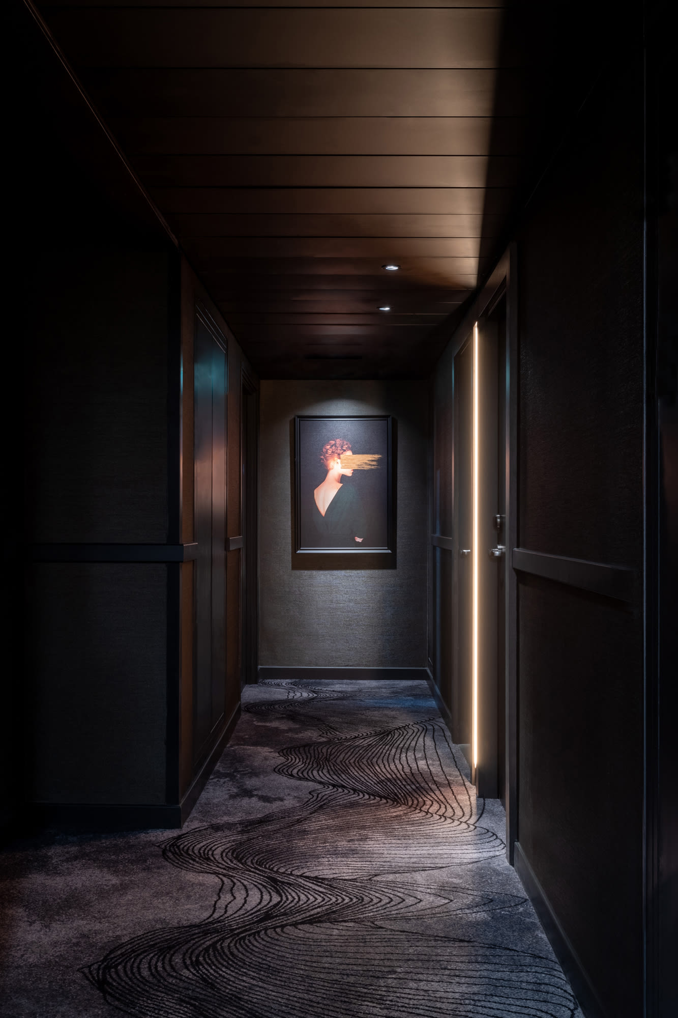 The corridors are sumptuous with a bespoke carpet design based on audio waves and transmissions, burnished gold metal detailing and a dark colour palette