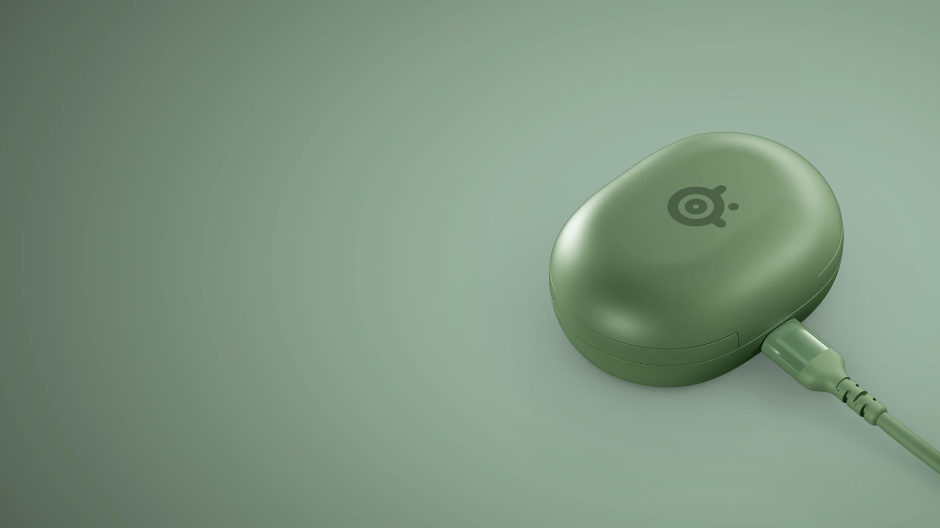 Matcha green SteelSeries Arctis GameBuds wireless charging case connected to USB-C power cable.