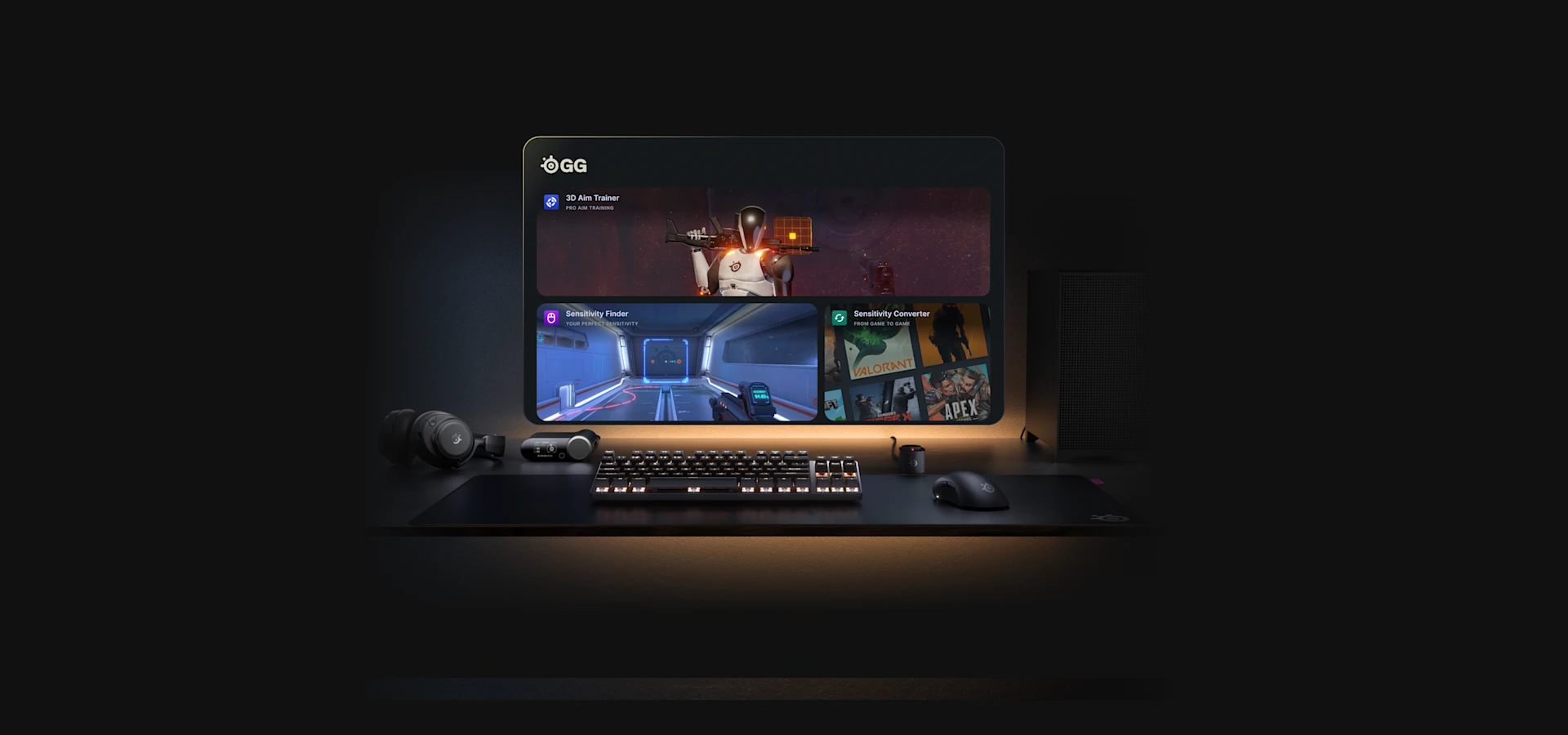 A dark desktop setup featuring a keyboard, mouse, and headset, with a monitor displaying the SteelSeries GG software interface.