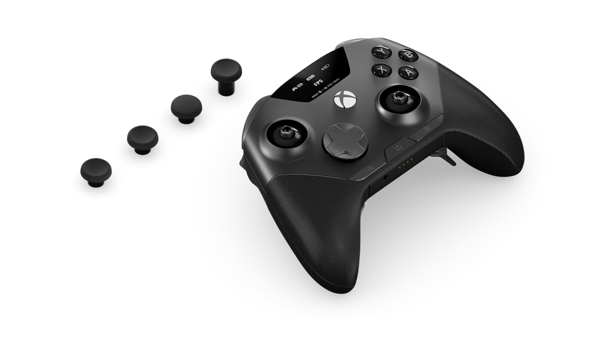 黑色 SteelSeries Aeon Pro 游戏手柄的俯视图,图中拇指摇杆杆身裸露,四枚高度各异的可替换摇杆头整齐排列在黑色背景上。