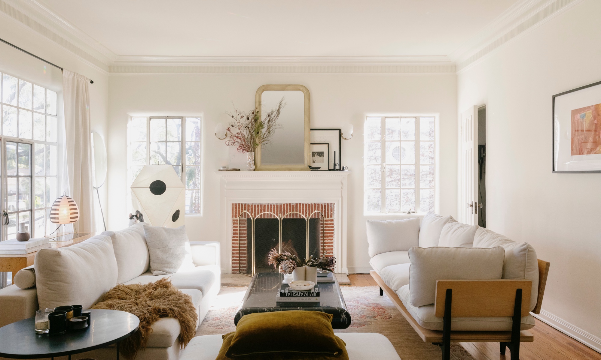 Madelynn's bright living room color scheme is ideal for her apartment's excellent natural light. Oat floyd sofa makes the room.