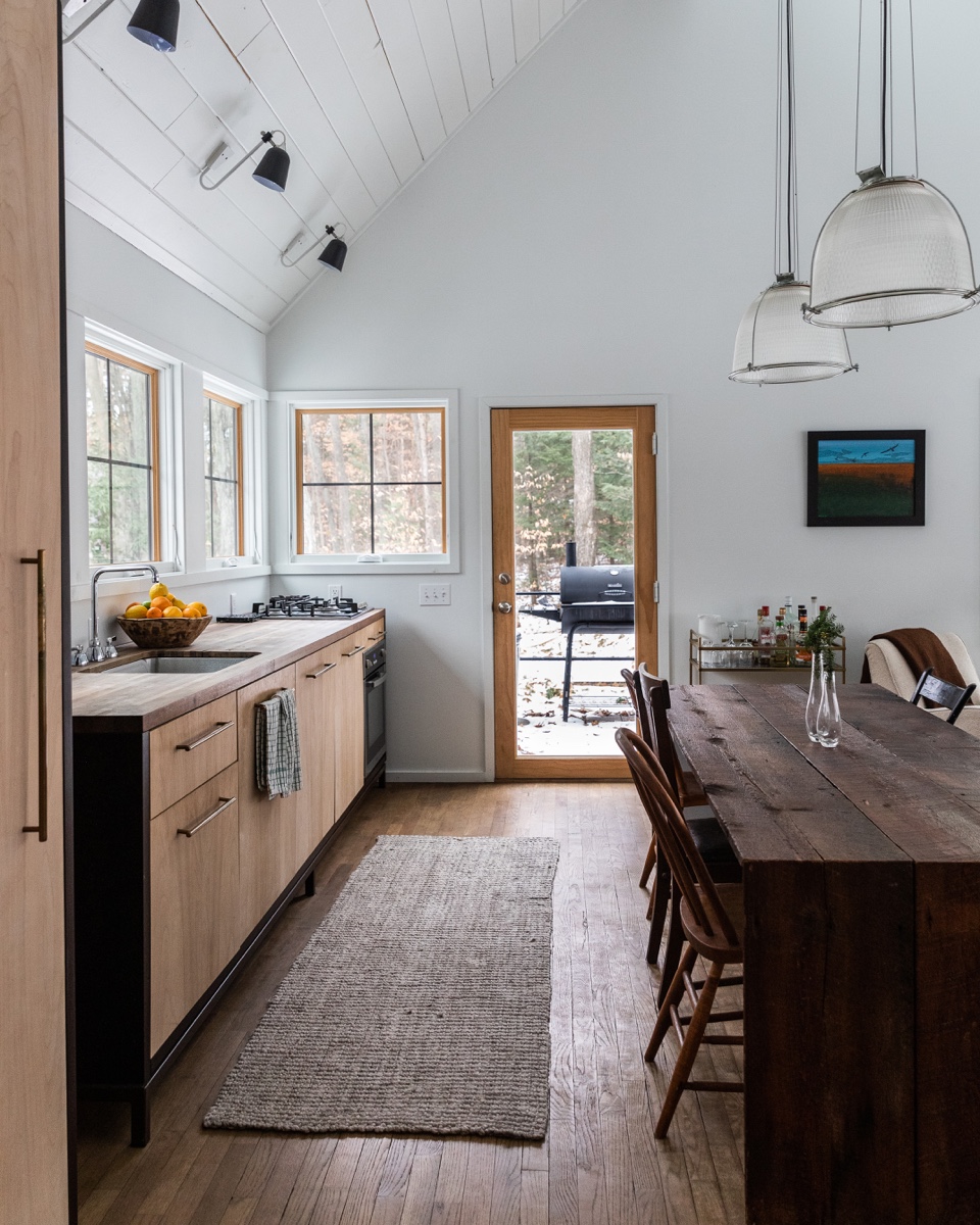Scandinavian European modern design with long wood dining table