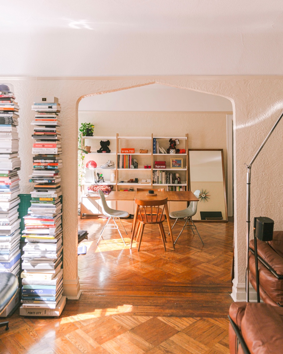 The apartment's south facing light highlights the floyd shelving system.