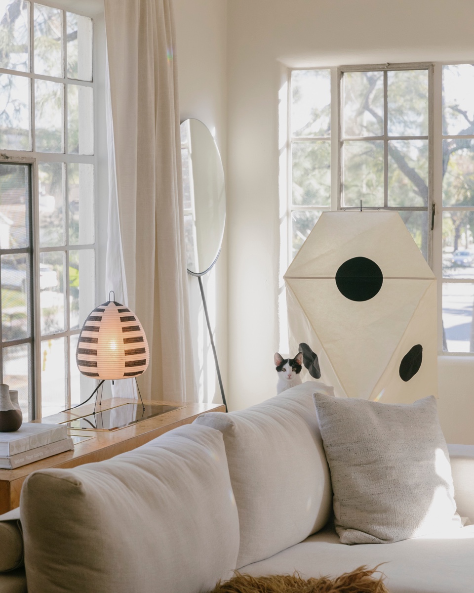 Noguchi lamps in a white living room.