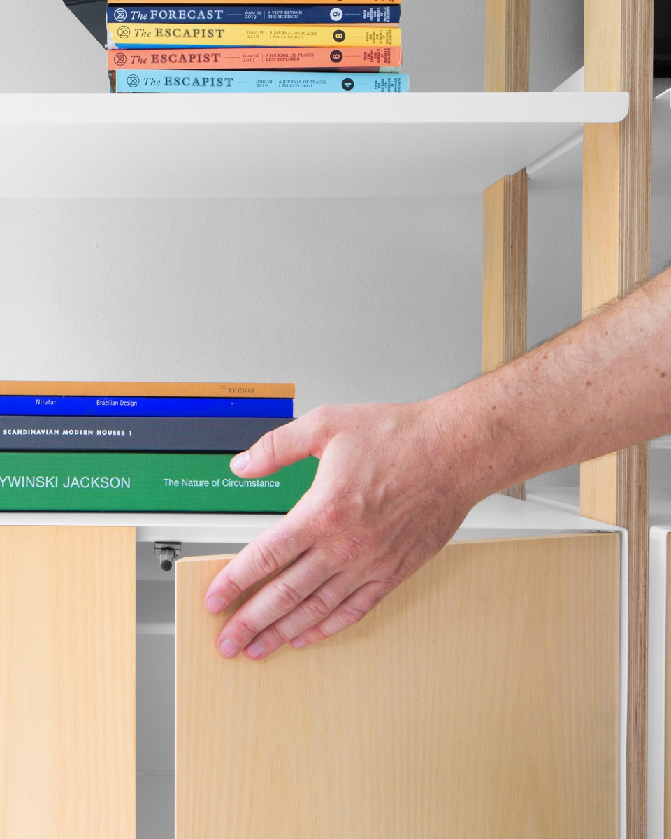 Hidden door catches leave the sleek ash cabinet face as the center of attention.