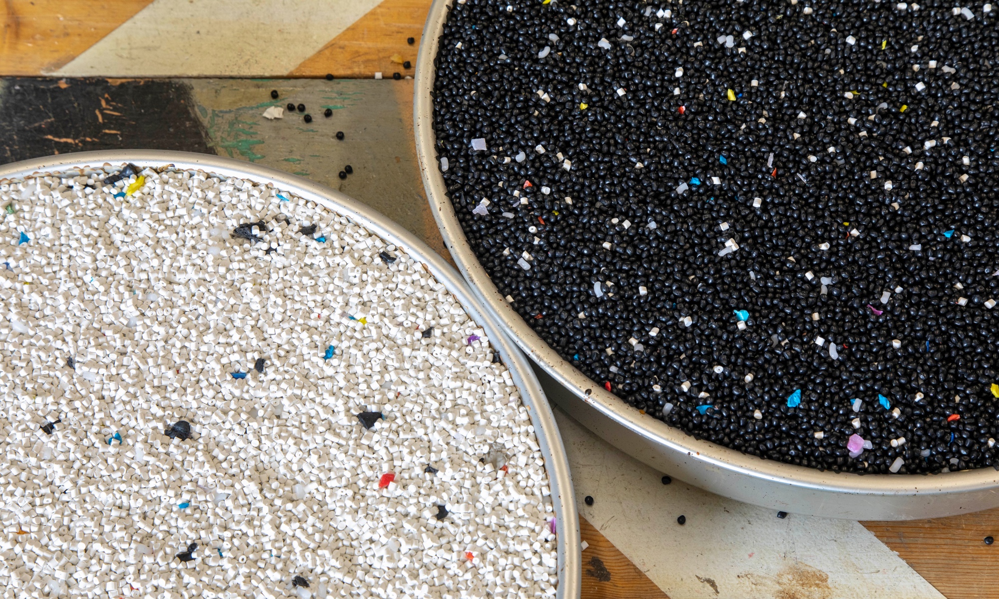 Each table surface is a blend of auto-industry scraps & colorful remnants from toy manufacturing.