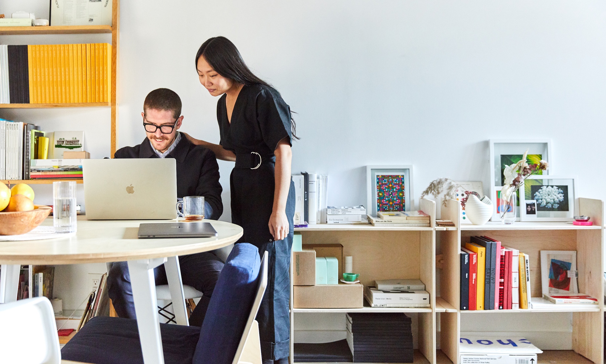 Estee & Jesse's space reflects their creative projects. and has a Floyd table.