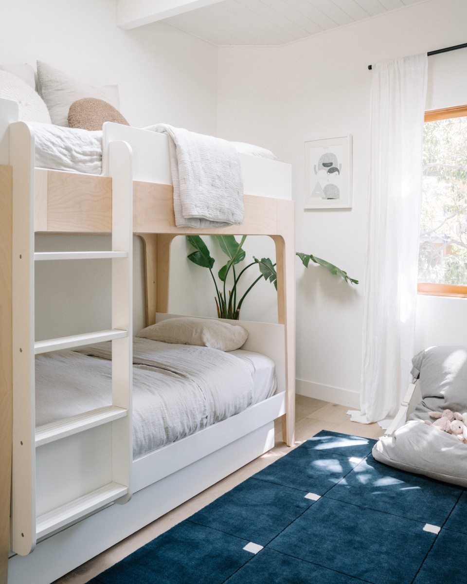 Bunk beds from Ouef make for a fun playspace in the children's room.