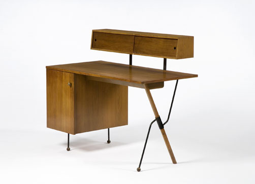A desk designed by Grossman, with her signature slender legs & mixed materials.