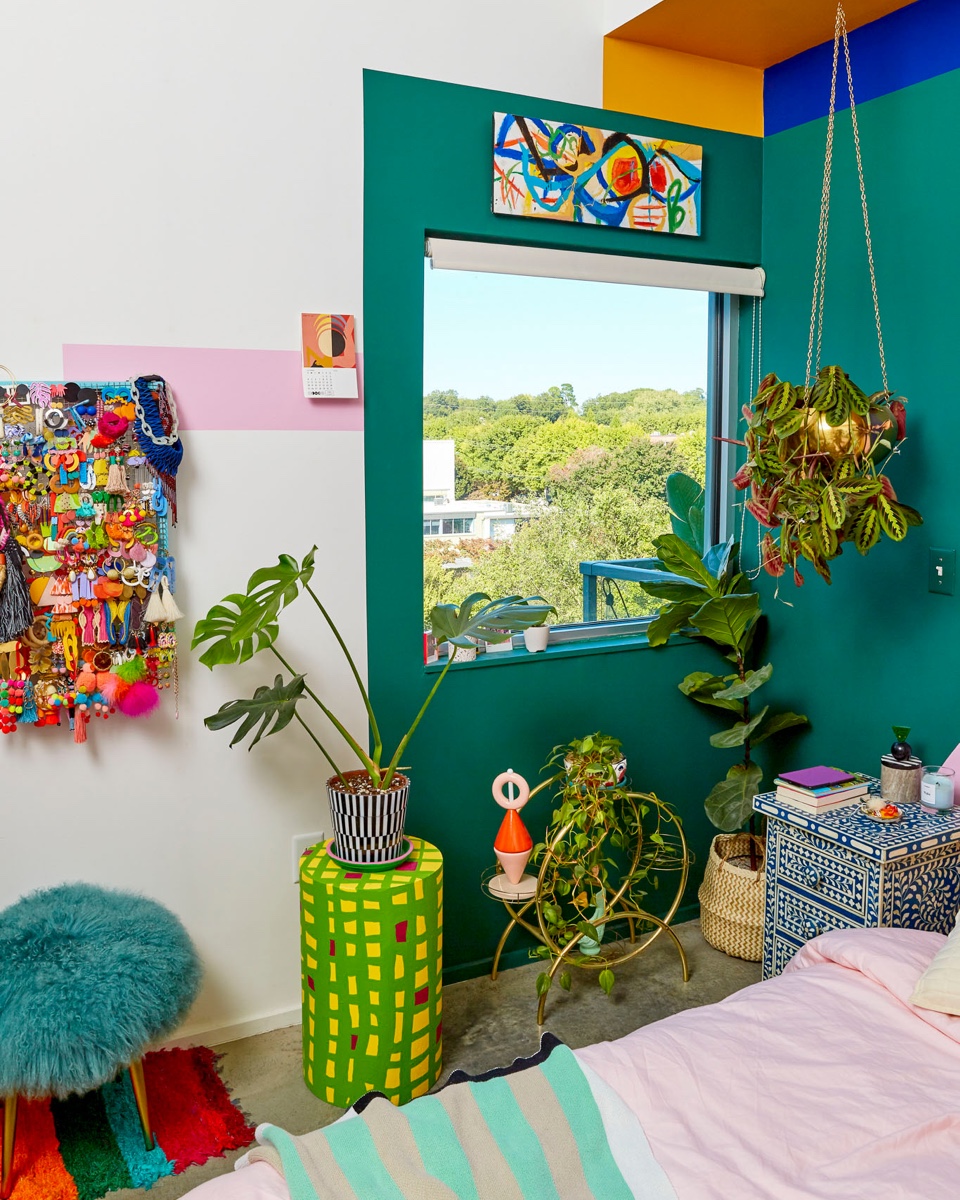 The color blocking serves to highlight the couple's equally bright collection of art & furniture.