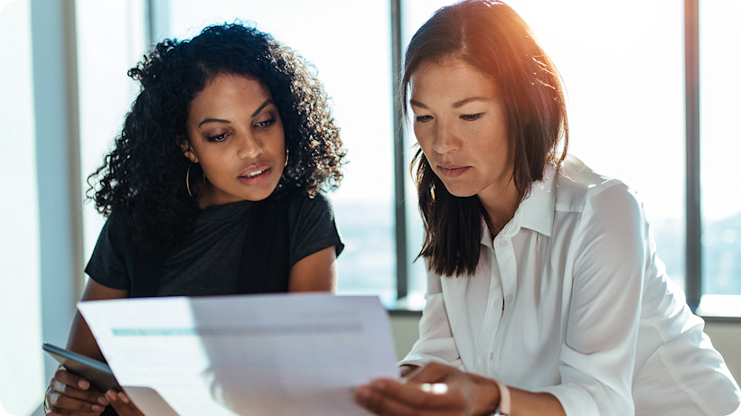 two-businesswomen-meeting-office-1440x1120.jpg