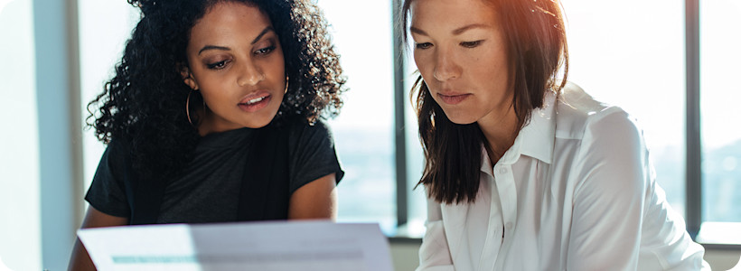 two-businesswomen-meeting-office-1440x1120.jpg