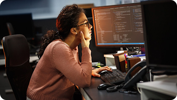 female-programmer-working-monitor-code-870x490
