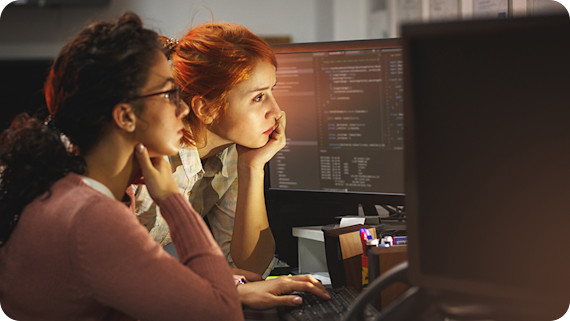 Managed-Solutions-870x490-Two female programmers working on new project