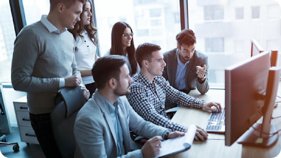 Software engineers working in office on project together.