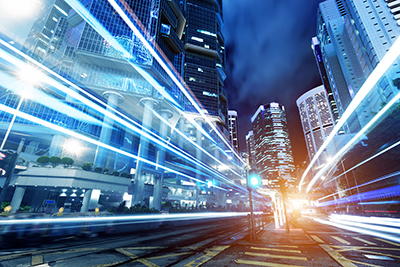 Office buildings with lights showing high speed