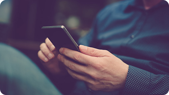 5G Close up of a man using mobile smart phone