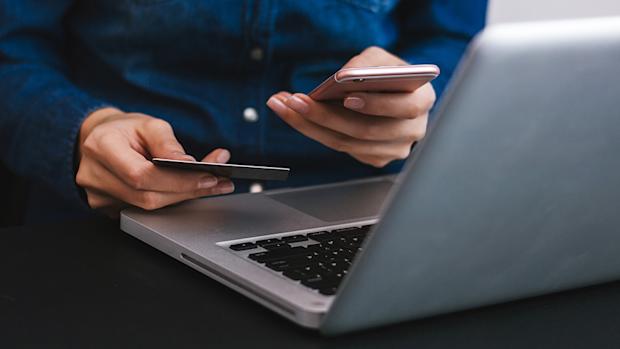 laptop-phone-making-purchase-870x490