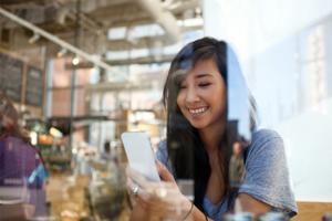 sc-Woman-looking-at-mobile-phone