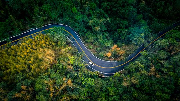 aerial-view-car-road-forest-870x490