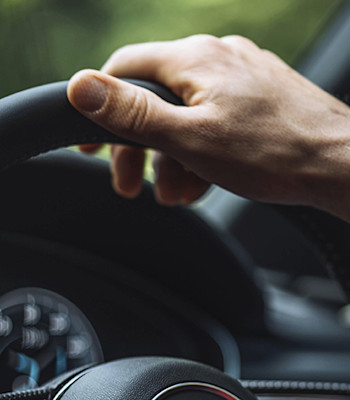 Automotive Ethernet closeup-hand-driving-870x490