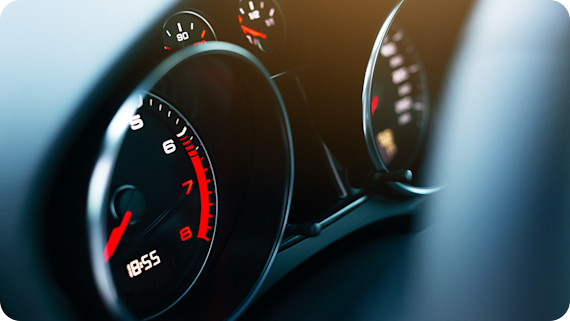 A car dashboard showing a rev counter