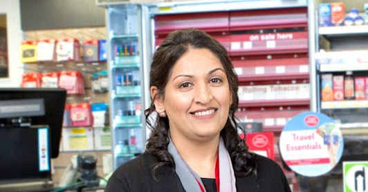 A photograph of Sal Ahmad standing inside Woodside Post Office A photograph of Sal Ahmad standing inside Woodside Post Office