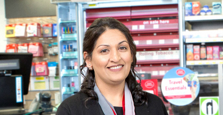 A photograph of Sal Ahmad standing inside Woodside Post Office A photograph of Sal Ahmad standing inside Woodside Post Office