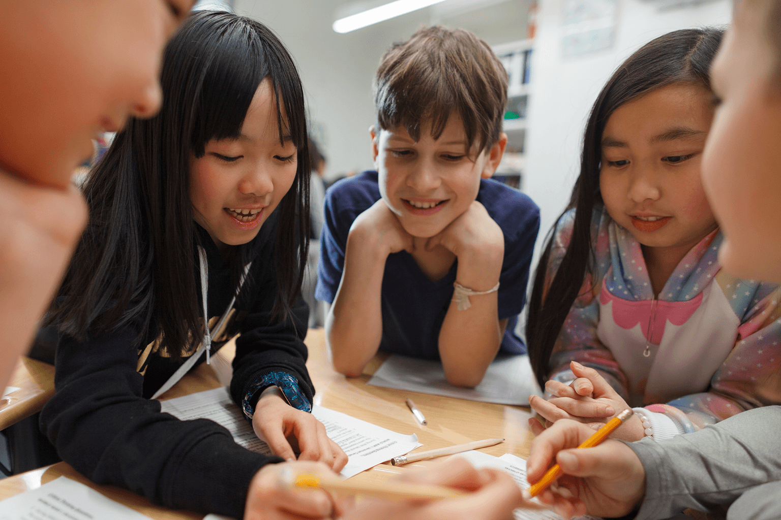 Children collaborating on a project for school.  Children collaborating on a project for school.