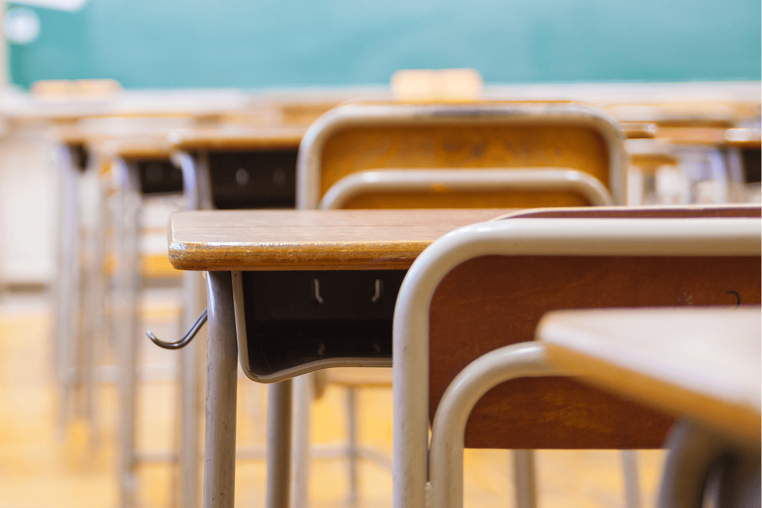 A classroom full of empty desks. A classroom full of empty desks.